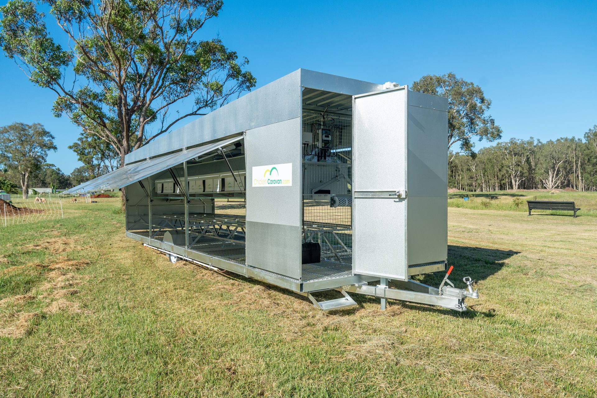 The Chicken Caravan 450 in 2021 Chicken Caravan 450 with all doors open in paddock