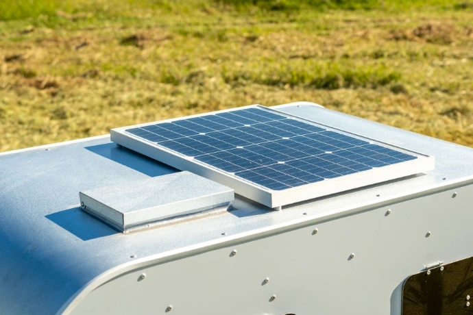 Solar panel to charge the battery and keep the automation going. Easy to use Feed fill point. Both are on the roof of the caravan